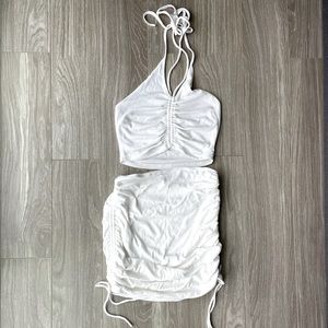 Two piece halter top with adjustable scrunch on the sides of the skirt & top